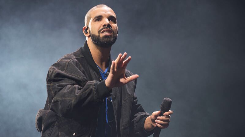 FILE - In this Oct. 8, 2016 file photo, Drake performs onstage in Toronto on Oct. 8, 2016....